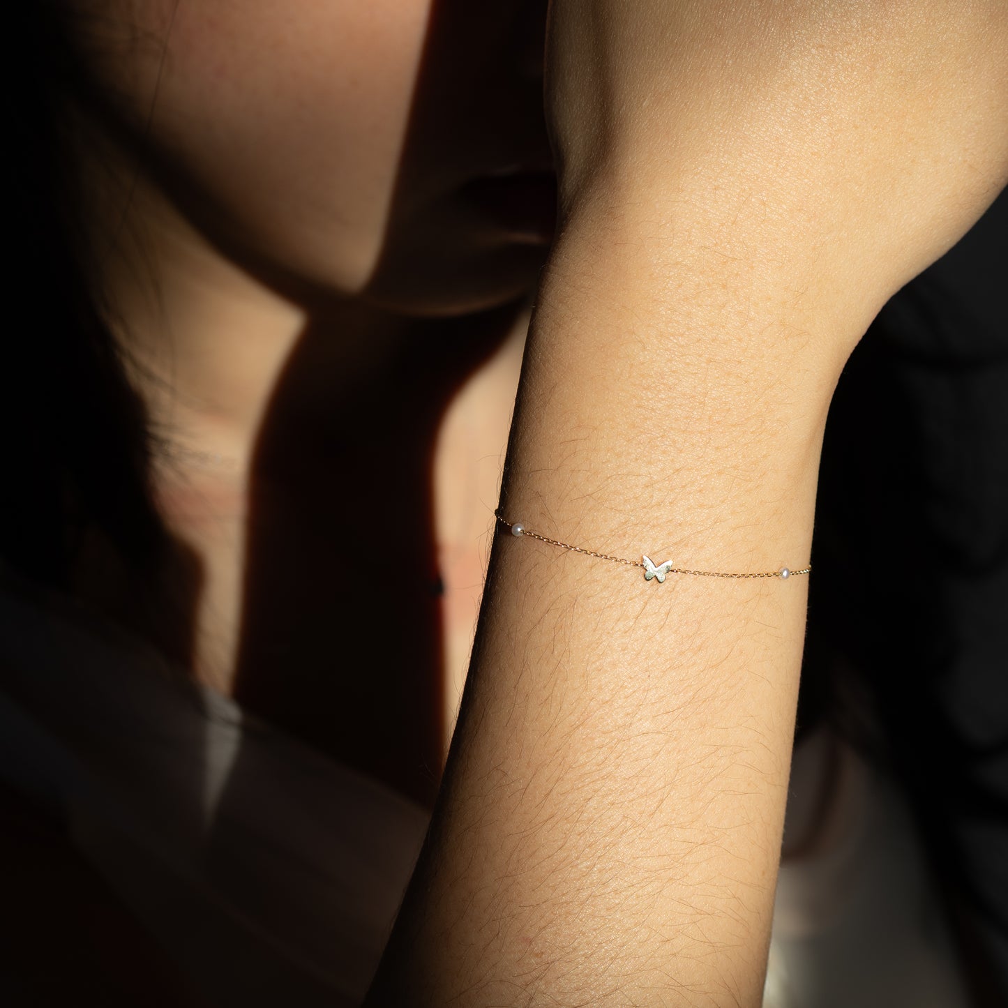 Delicate bracelet on a wrist with a blurred background